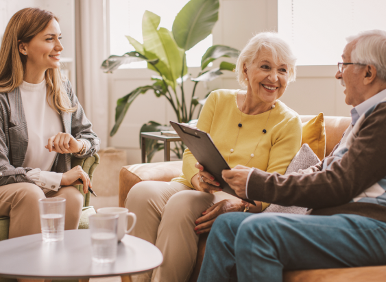 Three people meeting in a living room.